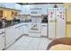 Functional kitchen featuring a refrigerator, and ample counter space at 1197 E Grove Ave, Lake Wales, FL 33853