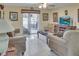 Bright living room with comfortable seating and sliding doors to the enclosed lanai at 1197 E Grove Ave, Lake Wales, FL 33853