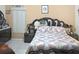 Elegant main bedroom with a beautiful statement headboard and side tables at 1197 E Grove Ave, Lake Wales, FL 33853