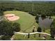 Aerial view of a well-maintained baseball field with a lake at 12021 Villanova Dr # 111, Orlando, FL 32837