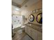 Bathroom featuring granite countertop, double sinks, shower and tub combination, and tile flooring at 12021 Villanova Dr # 111, Orlando, FL 32837