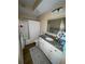 Bright bathroom with granite countertop vanity, decorative mirror, and shower-tub combo at 12021 Villanova Dr # 111, Orlando, FL 32837