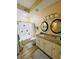 Well-lit bathroom with dual mirrors, granite counters, and shower-tub combination at 12021 Villanova Dr # 111, Orlando, FL 32837