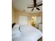 Bright bedroom features a ceiling fan, closet and adjacent doorway at 12021 Villanova Dr # 111, Orlando, FL 32837