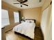 Bright bedroom features wood floors and a window for plenty of natural light at 12021 Villanova Dr # 111, Orlando, FL 32837