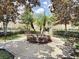 Beautiful community center green area with manicured landscape and benches at 12021 Villanova Dr # 111, Orlando, FL 32837
