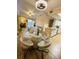 Dining area offers a view of the living room and kitchen, with light hardwood floors, and nice furnishings at 12021 Villanova Dr # 111, Orlando, FL 32837