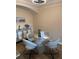 Bright dining area features wood-look floors, modern light fixture, and unique table at 12021 Villanova Dr # 111, Orlando, FL 32837