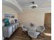 Dining area with wood-look floors, modern light fixture and unique table and chairs at 12021 Villanova Dr # 111, Orlando, FL 32837
