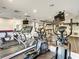 Modern gym with treadmills, elliptical machines, and mounted TVs for entertainment at 12021 Villanova Dr # 111, Orlando, FL 32837