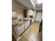 Kitchen featuring stainless steel appliances, granite countertops, white cabinets, and breakfast bar at 12021 Villanova Dr # 111, Orlando, FL 32837