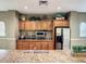 Kitchenette featuring granite countertops, stainless steel appliances, and ample cabinet space at 12021 Villanova Dr # 111, Orlando, FL 32837