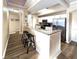 Open kitchen with granite countertops, stainless appliances, and breakfast bar seating at 12021 Villanova Dr # 111, Orlando, FL 32837