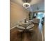 Open floor plan showcasing dining and living spaces with hardwood flooring at 12021 Villanova Dr # 111, Orlando, FL 32837