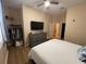 Spacious main bedroom with dresser, TV, ceiling fan and a closet with clothes at 12021 Villanova Dr # 111, Orlando, FL 32837