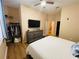 Bright bedroom features wood floors, walk in closet, and ensuite bathroom at 12021 Villanova Dr # 111, Orlando, FL 32837