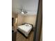 Bright main bedroom with ceiling fan, wood floor, and view to ensuite bathroom at 12021 Villanova Dr # 111, Orlando, FL 32837