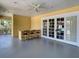 Outdoor bar area with bar seating and ceiling fan near pool access through glass paneled doors at 12021 Villanova Dr # 111, Orlando, FL 32837
