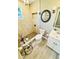 Stylish bathroom featuring a pebble-stone shower, unique decor, and a modern vanity at 13 E 8Th St, Frostproof, FL 33843