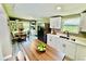 Eat-in kitchen featuring stainless steel appliances, white cabinets, and a breakfast nook at 13 E 8Th St, Frostproof, FL 33843