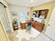 Home office featuring a large window, a built-in bookshelf, and modern decor at 13 E 8Th St, Frostproof, FL 33843