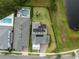 Overhead view showcasing the home's backyard pool, lush landscaping, and solar panels at 14081 Gullstrand Ave, Orlando, FL 32827