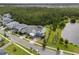 Aerial view of the property showcasing its proximity to a serene lake and lush green space at 14081 Gullstrand Ave, Orlando, FL 32827