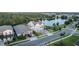Expansive aerial view of the home showcasing its prime location near a lake, surrounded by lush greenery at 14081 Gullstrand Ave, Orlando, FL 32827