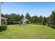 A spacious backyard with a wooden playset and green grass at 14081 Gullstrand Ave, Orlando, FL 32827