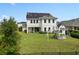 Spacious backyard featuring a covered patio, play set, and lush lawn, ideal for outdoor living at 14081 Gullstrand Ave, Orlando, FL 32827