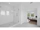 Bright bathroom with a glass-enclosed shower and a view of the bedroom at 14081 Gullstrand Ave, Orlando, FL 32827
