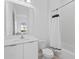 Clean bathroom featuring white fixtures, subway tile, and modern design elements at 14081 Gullstrand Ave, Orlando, FL 32827