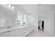 Luxurious bathroom with dual vanities, walk-in shower, and elegant finishes at 14081 Gullstrand Ave, Orlando, FL 32827