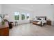 Spacious bedroom with a large bed, stylish furnishings, and ample natural light at 14081 Gullstrand Ave, Orlando, FL 32827