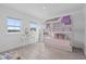Bright bedroom featuring a bunk bed with pull out drawers and makeup vanity at 14081 Gullstrand Ave, Orlando, FL 32827