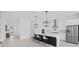 Open modern kitchen with a large island, pendant lights and stainless steel appliances at 14081 Gullstrand Ave, Orlando, FL 32827