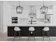 Open kitchen featuring a large island, pendant lighting and stainless steel appliances at 14081 Gullstrand Ave, Orlando, FL 32827