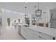 Open floor plan with skylights featuring a large island and stainless steel appliances at 14081 Gullstrand Ave, Orlando, FL 32827