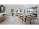 Bright living room with skylights, lake views, and modern furnishings at 14081 Gullstrand Ave, Orlando, FL 32827