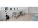 Comfortable living room with soft chairs and views of treeline through the windows at 14081 Gullstrand Ave, Orlando, FL 32827