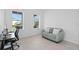 Bright office space with modern desk, comfortable seating, and large windows at 14081 Gullstrand Ave, Orlando, FL 32827