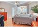 Relaxing bedroom featuring a cozy bed, ample natural light, and a tranquil decor at 142 Largo Dr, Poinciana, FL 34759