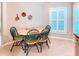 Bright breakfast nook area with natural light and a charming dining set at 142 Largo Dr, Poinciana, FL 34759