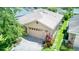 Well maintained home featuring neutral tones, paver driveway and colorful landscaping at 142 Largo Dr, Poinciana, FL 34759