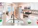 Well-lit kitchen boasting stainless steel appliances, sleek countertops, and a modern tile backsplash at 142 Largo Dr, Poinciana, FL 34759