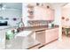 Stylish kitchen with granite countertops, stainless dishwasher, tile backsplash and custom cabinetry at 142 Largo Dr, Poinciana, FL 34759