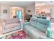 Open living space with tile flooring, comfortable seating, and an adjacent kitchen and dining area at 142 Largo Dr, Poinciana, FL 34759