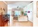Open-concept living room with neutral tones, tile flooring, comfortable seating, and a decorative ceiling fan at 142 Largo Dr, Poinciana, FL 34759