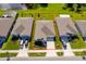 Aerial view of a home with a well-manicured lawn and a red boundary line at 1959 Cricket Cradle Dr, Kissimmee, FL 34746