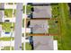 Aerial view of a home with a grassy yard and a pond nearby, marked with a red boundary at 1959 Cricket Cradle Dr, Kissimmee, FL 34746